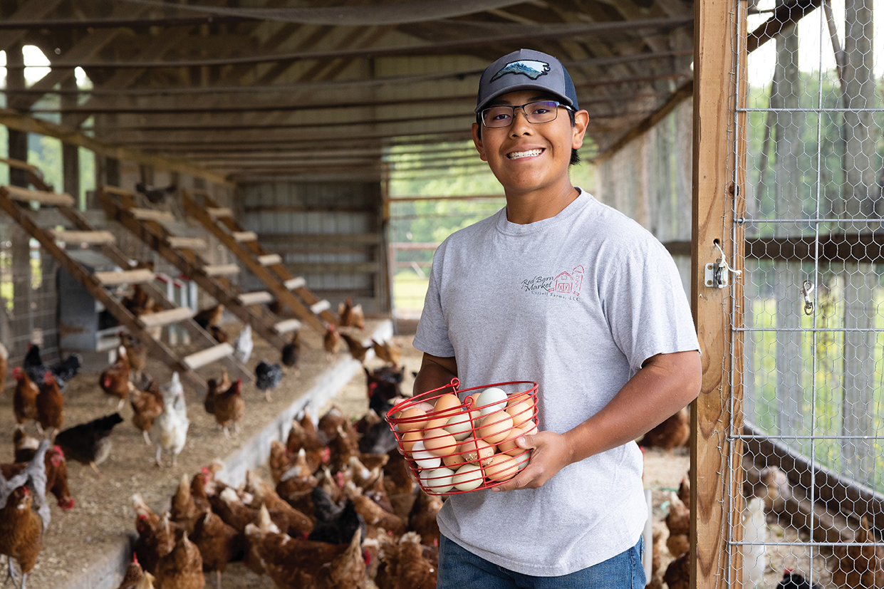Talton Correll holding a basket of eggs