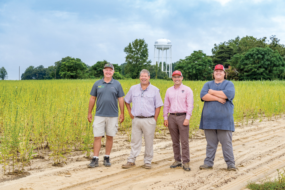 Neal and his son Hayden, far right, also work with agronomist Willie Howell, far left.