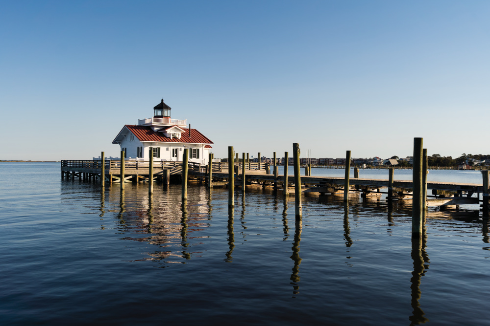 A charming scene from Manteo on Roanoke Island, a picturesque waterfront town in the heart of the Outer Banks. From its quaint downtown streets to its marina views and vibrant local culture, Manteo blends coastal beauty with small-town charm, offering a glimpse into life by the water.