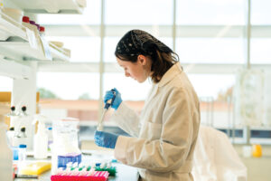 Claire Patrick works in the lab at the NC State Plant Sciences Building