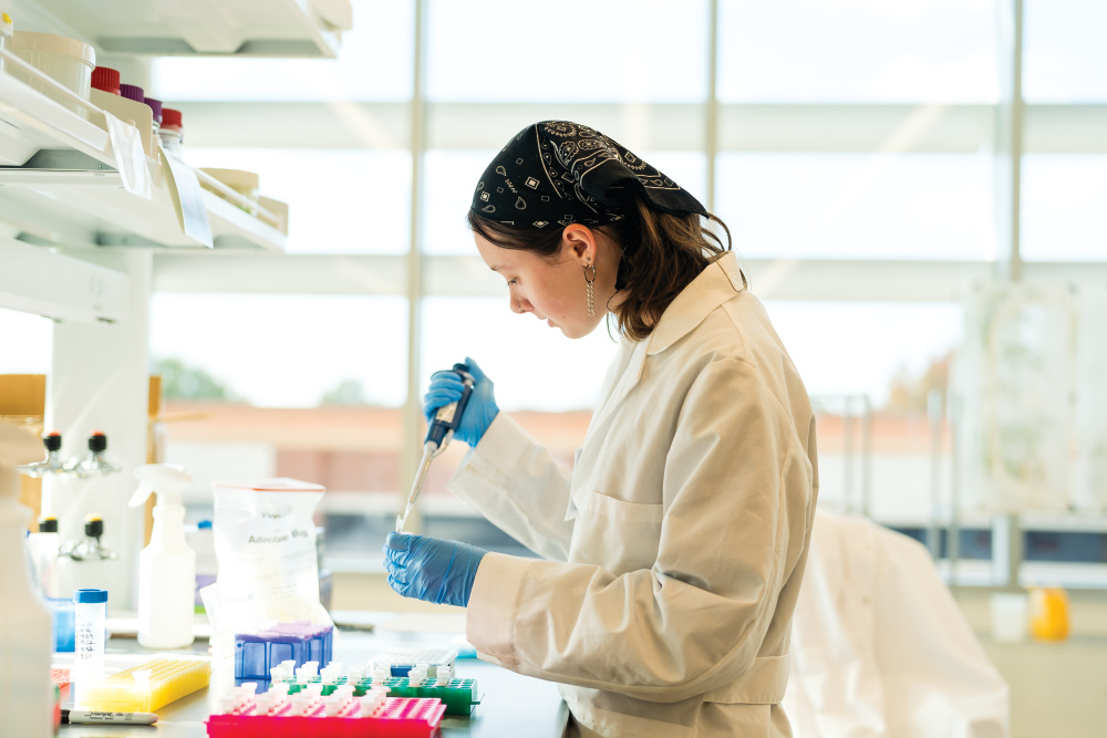 Claire Patrick works in the lab at the NC State Plant Sciences Building