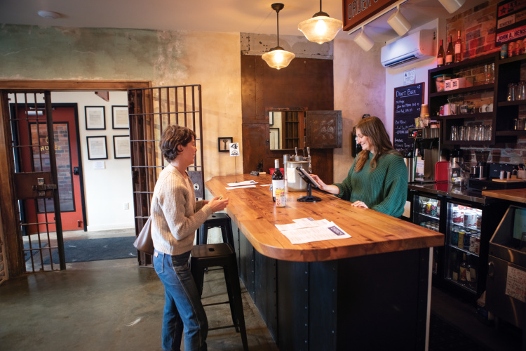 Sierra Byrd serves customers at Zadies Market, remodeled out of the old Marshall Jail, in downtown Marshall. ©Journal Communications/Nathan Lambrecht