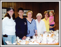 Yadkin County Farm Bureau’s Women’s Committee Members (from left) Heather Smith, Becky Smith, Karen Matthews, Martha Fleming and Cindy Matthews presented loaves of bread to teachers at Forbush and Starmount High Schools.