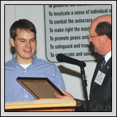 Lucas Richard, left, received the Outstanding Contributor to Agriculture Award from Richard Thompson, of the Hickory Kiwanis Club.
