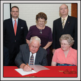 Rockingham County Farm Bureau has established a $50,000 scholarship to honor J.M. Wright Jr. On hand for the signing were (seated, left to right) Rockingham County Farm Bureau President Darryl Dunagan; J.M. Wright Jr.; Leola Meador, Scholarship Chair; (standing, left to right) Sharon Runion Rowland, Executive Director of the N.C. Cooperative Extension Foundation; Ken Sigmon, Associate Vice Chancellor at NCSU; Mrs. J.M. Wright; and Jon Ort, Assistant Vice Chancellor and Director of N.C. Cooperative Extension.