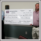 FRANKLIN COUNTY Farm Bureau President Bennie Ray Gupton, left, and Franklin County YF&R Chairman Jason Aycock display a $300 check that will go to Franklin County Care & Share as part of the group’s Harvest for All project.