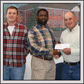 Pictured, left to right, are: Surry County Farm Bureau member Charles Boles; an Elkin High School FFA officer; agriculture teacher Clarence Edwards; Surry County Farm Bureau President David Haynes and another FFA officer.