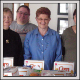 MITCHELL COUNTY Farm Bureau Women’s Committee packed food gift baskets to be distributed to Mitchell County families during the Christmas season. Pictured, back left to right, are Women’s Committee members Doris Terrell, Tara McCann, Carol Masters and Carol Wright; and front left to right, Women’s Committee Chair Dorothy Campbell presenting a basket to Pat Paton with the Mitchell County Department of Social Services. 