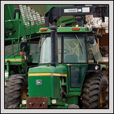A cotton harvester dumps another freshly picked load at Burleson’s farm. 