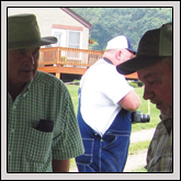 Haywood County Farm Bureau board member Terry Rogers distributed hats and more during Forage Field Day at the Mountain Research Station in Waynesville.