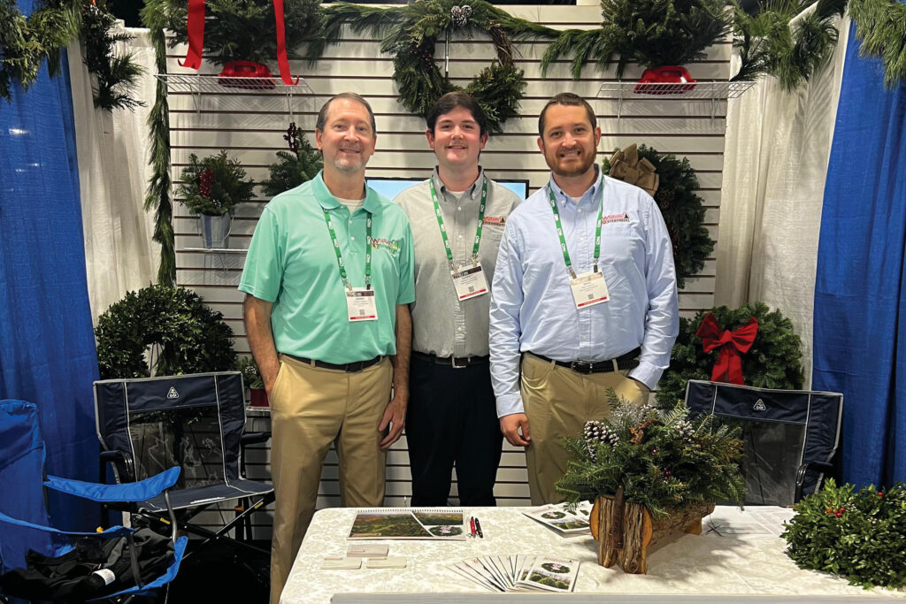 Brad Wishon, right, grows trees with his father, Johnny, and brother, Garrett, on their farm in Sparta. North Carolina Christmas trees
