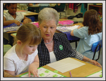Bladen County Farm Bureau and State Women’s Committee Member Brenda Brisson works with a student at Dublin Primary School.