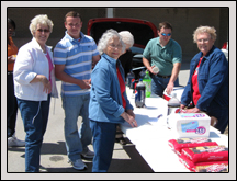 Craven County Farm Bureau President Jason Jones and Women’s Committee members serve soda and cookies during a DWI Awareness Program at West Craven High School. 