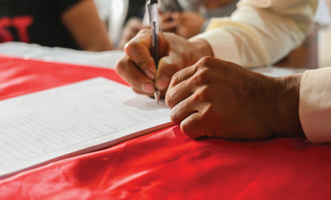 hands and a contract