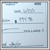 WATAUGA COUNTY Farm Bureau member Daniel Brown, right, received the honor of having the Supreme Champion Heifer at the Northwest Livestock Show held June 23 at the Dixie Classic Fairgrounds in Winston-Salem. Daniel is the son of Blake and Ann Brown.